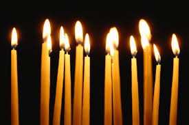Memorial candles burning in prayer